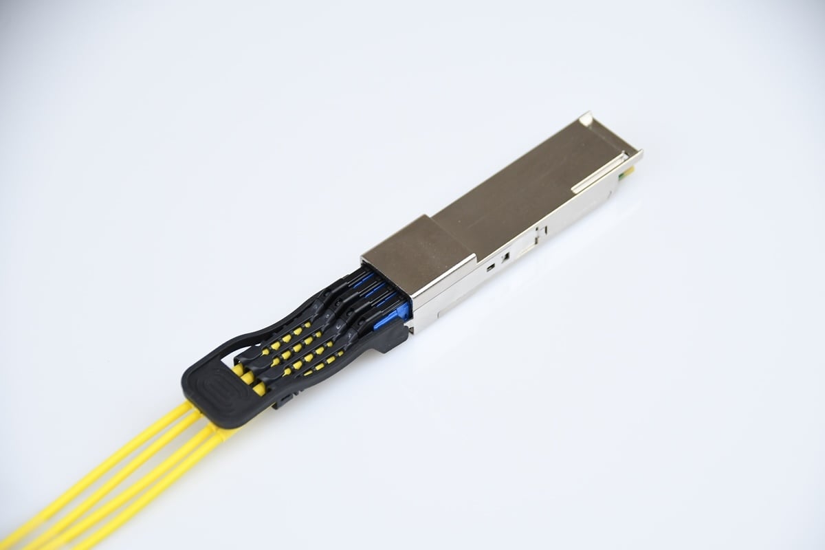 Image showing four SN duplex connectors in a single 8-fiber transceiver.